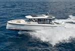 Saxdor 340 GTWA - 2025 Saxdor 340 GTWA boat cruising on open sea, creating splashes.