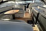 Sunseeker Camargue 50 - Interior of 2001 Sunseeker Camargue 50 yacht with elegant seating and wooden table.