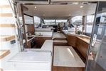 Princess F55 - Luxurious interior of 2021 Princess F55 yacht with modern kitchen and seating area.