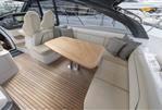 Princess V50 Open - Luxurious 2023 Princess V50 Open yacht interior with elegant seating and wooden table.
