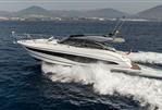 Princess V50 Open - 2023 Princess V50 Open yacht cruising on the ocean with scenic mountain backdrop.