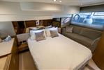 Princess 49 - Luxurious bedroom interior of 2018 Princess 49 yacht with elegant furnishings and soft lighting.