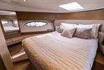 Princess 49 - Luxurious cabin interior of 2018 Princess 49 yacht with elegant bedding and modern design.