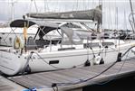 Hanse 388 - 2021 Hanse 388 sailboat docked at marina, featuring sleek design and modern amenities.