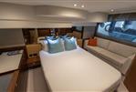 Princess F50 - Luxurious 2019 Princess F50 yacht bedroom with elegant decor and comfortable seating.