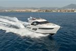 Princess F50 - 2019 Princess F50 yacht cruising on open water with scenic coastal backdrop.