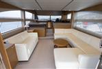 Princess 56 - Luxurious interior of a 2014 Princess 56 yacht with elegant white seating and modern design.