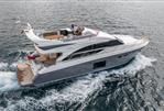 Princess 56 - Luxurious 2014 Princess 56 yacht cruising on open water, showcasing sleek design and elegance.