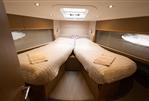 Princess V52 - Luxurious 2014 Princess V52 yacht cabin with twin beds and modern lighting.