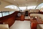 Fairline 50 Fly - BriOpen-plan living area designed for comfort and style.ght and welcoming salon with plush seating.