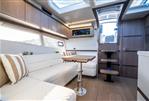 Galeon 405 HTS - Luxurious interior of 2023 Galeon 405 HTS yacht with modern seating and wooden accents.