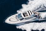 Galeon 405 HTS - 2023 Galeon 405 HTS yacht cruising on open water, aerial view.