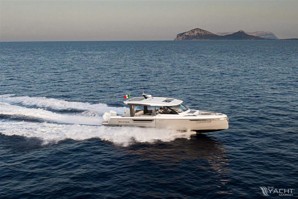 Saxdor 400 GTO - 2025 Saxdor 400 GTO cruising on open sea with distant island backdrop.