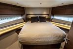 Princess F58 - Luxurious 2025 Princess F58 yacht bedroom with elegant wood finishes and modern design.
