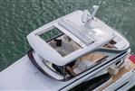 Princess F58 - Aerial view of 2025 Princess F58 yacht with open sunroof on water.