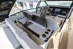 Saxdor 320 GTO - Interior of 2025 Saxdor 320 GTO boat featuring helm, seating, and kitchenette area.