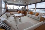 Princess 68 - Luxurious interior of a 2015 Princess 68 yacht with elegant seating and panoramic windows.