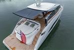 Princess V55 - Luxurious 2025 Princess V55 yacht with sunshade and elegant deck design on calm water.
