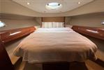 Princess V48 - Luxurious cabin interior of a 2007 Princess V48 yacht with a cozy bed.