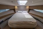 Princess V40 - Luxurious bedroom interior of 2019 Princess V40 yacht with skylight and modern design.