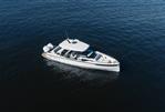 Saxdor 320 GTO - 2025 Saxdor 320 GTO boat cruising on open water, aerial view.