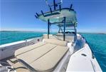 Axopar 37 Sun Top - 2024 Axopar 37 SunTop boat with sunbed, cruising on clear blue waters.