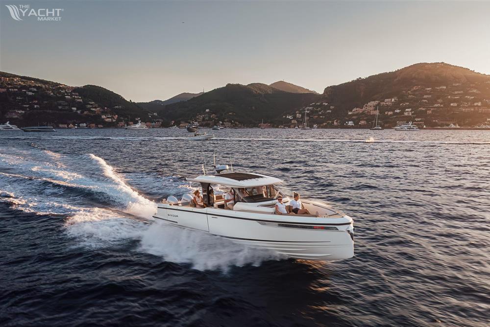 Saxdor 400 GTS - 2025 Saxdor 400 GTS cruising on scenic coastal waters at sunset.