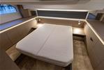 Prestige 420 - Luxurious cabin interior of 2022 Prestige 420 yacht with modern bed and ambient lighting.