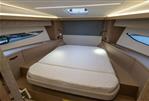 Prestige 420 - Luxurious cabin interior of 2022 Prestige 420 yacht with modern design and comfortable bed.