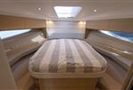 Princess V40 - Luxurious interior cabin of 2018 Princess V40 yacht with cozy bed and modern design.
