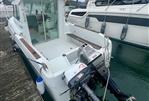 Jeanneau Merry Fisher 610 HB - Jeanneau Merry Fisher 610 HB 1997 boat docked with outboard motor.