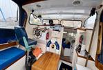 Maritime 21 - Interior of a 1992 Maritime 21 boat with steering wheel and seating area.