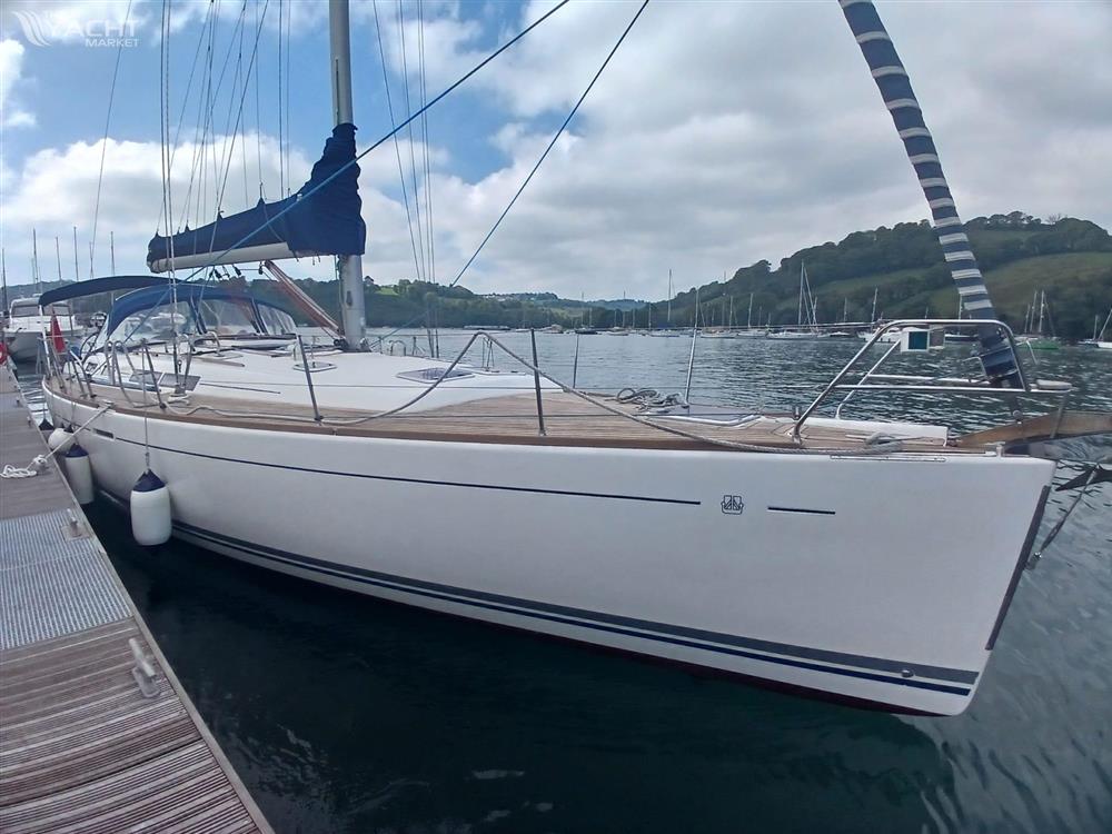 Dufour 455 Grand Large - 2006 Dufour 455 Grand Large yacht docked at a marina, under a cloudy sky.