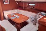 Dufour 455 Grand Large - Interior of 2006 Dufour 455 Grand Large yacht with elegant wooden dining area.