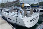 Dufour 410 - 2014 Dufour 410 sailboat named "Mojo" docked at a marina.