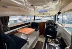 Parker Poland 800 Weekend - Interior of 2017 Parker Poland 800 Weekend boat with seating, table, and helm.