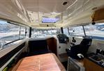 Parker Poland 800 Weekend - Interior of 2017 Parker Poland 800 Weekend boat, featuring helm, seating, and kitchenette.