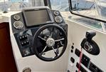 Parker Poland 800 Weekend - Cockpit of 2017 Parker Poland 800 Weekend boat with steering wheel and control panel.