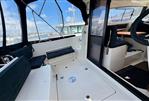 Parker Poland 800 Weekend - 2017 Parker Poland 800 Weekend boat interior with seating and helm, docked at marina.