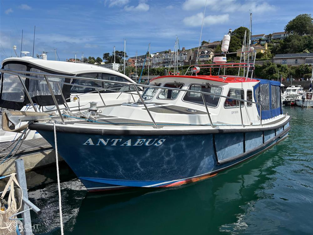 Lochin Fast Fisher - 1996 Lochin Fast Fisher boat named Antaeus docked in a marina under a clear blue sky.