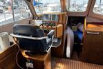 Lochin Fast Fisher - Interior of a 1996 Lochin Fast Fisher boat with steering wheel and control panel.