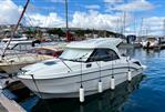 Beneteau Antares 8 - 2019 Beneteau Antares 8 docked in a marina, surrounded by other boats.