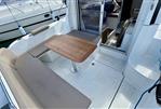 Beneteau Antares 8 - Beneteau Antares 8 (2019) boat interior with seating and wooden table.