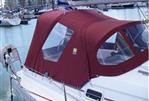 Beneteau Oceanis 321 - 1998 Beneteau Oceanis 321 sailboat with red canopy docked in marina.
