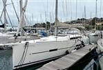 Dufour 412 Grand Large - 2018 Dufour 412 Grand Large sailboat docked in a marina, surrounded by other boats.