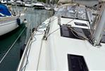 Dufour 412 Grand Large - 2018 Dufour 412 Grand Large sailboat docked in marina, showcasing deck and rigging.