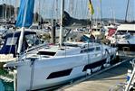 Dufour 41 - 2025 Dufour 41 yacht docked in a marina, surrounded by other boats.