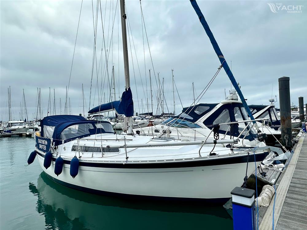 Moody 30 - 1978 Moody 30 sailboat docked in a marina under cloudy skies.
