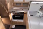 Dufour 37 - Modern kitchen area in 2025 Dufour 37 yacht with sleek cabinetry and appliances.