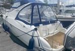 Gobbi 345SC - 2005 Gobbi 345SC yacht docked at marina with blue canopy and fenders.